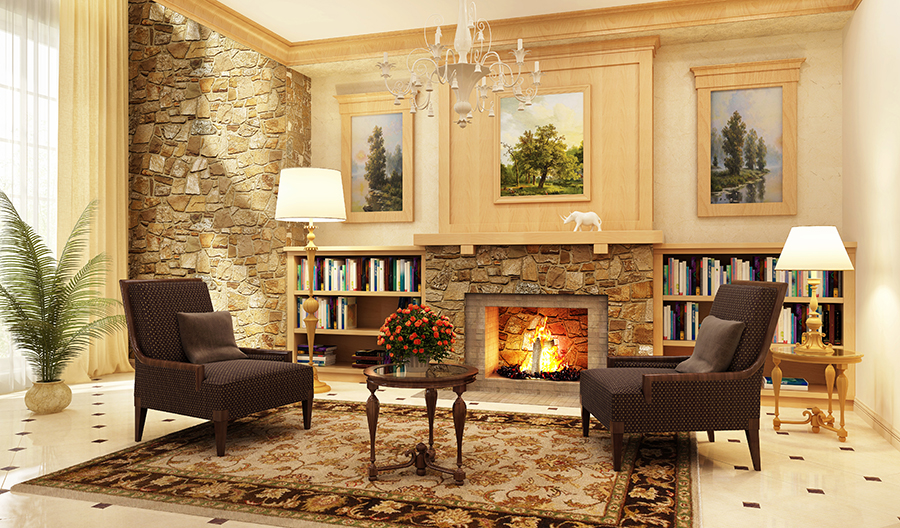 Beautiful living room staged for fall with a fire burning in the fireplace