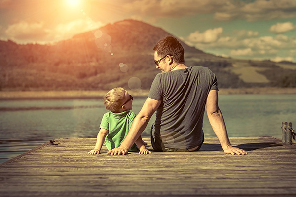 Father and son enjoying quality time together on a beach